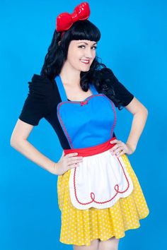 SNOW WHITE APRON for women Comes in 2 sizes for Women- SM/MED fits extra small to about a size 12/14 LG/XL fits 12to 24 This is such a pretty version of my popular apron dress Wear this beautiful hostess apron to impress your guests at your next party This apron is a version of my popular apron dress. This is made with yellow polka dots, and has a white apron with fun red ric rac details. It has a red band to set it off. The heart shaped bib is lined with ric rac trim trim. The second photo is n Disney Princess Aprons, Disney Aprons, Princess Aprons, Snow White Costume, Snow White Party, Hostess Apron, White Costumes, Retro Apron, An Apron