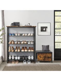 the shoe rack has many pairs of shoes on it and is next to a chair