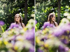 a woman standing in front of purple flowers