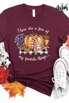 These are a few of my favorite things shirt, I love fall shirt, adorable fall shirt, cute fall t-shirt, cute shirt for fall, shirt with buffalo plaid, This trendy fall design is a perfect way to show your love of fall, pumpkin spice, mums, boots, buffalo plaid, fall treats, scarves and pumpkins. This fall shirt would be great with your fall wardrobe. Pair this fall t-shirt with a pair of jeans, boots and a jacket or cardigan and you'll be stylin' for the fall season. Brown Graphic Tee For Fall, Trendy Brown T-shirt For Fall, Fall Graphic Tee In Brown, Brown Letter Print T-shirt For Fall, Brown Graphic Print T-shirt For Fall, Fall Tee Shirts, Jeans Boots, Fall Tee, Fall Treats