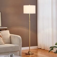 a living room scene with focus on the floor lamp