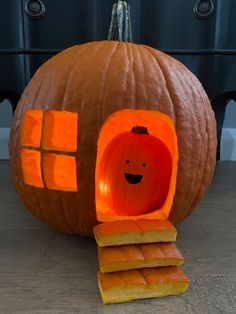 a pumpkin shaped like a house with a hole in it