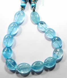 a necklace made with blue glass beads