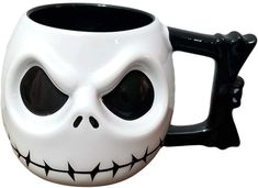 a black and white mug with a skull face on it's side, in front of a white background