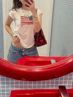 american flag ralph lauren shirt, white tee shirt, lowrise jeans, jorts, outfit inspo, summer, red bag, red white blue American Flag T Shirt, Jorts Outfit, White Tee Shirt, American Flag Tshirt, White Tee Shirts, Outfit Inspo Summer, Red Bag, Tshirt Outfits