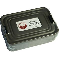 the ultimate adventure survival kit is packed in a metal container with an aluminum lid and handle