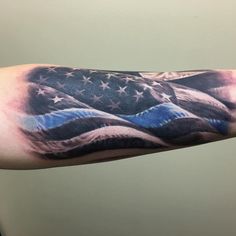 an american flag tattoo on the arm