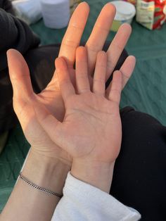 a person holding their hand up in the air