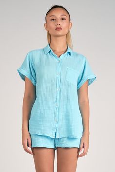 Crafted from 100% cotton, our Dolly Button Down Top boasts a relaxed fit and classic silhouette, making it the ultimate versatile piece for beach days. Pair it with our Bay shorts for a cute set that'll keep you stylish and comfortable all summer long. Relaxed Cotton Shorts For Beach Season, Cotton Summer Sleepwear, Summer Cotton Sleepwear, Cotton Sleepwear With Relaxed Fit For Summer, Relaxed Cotton Pajama Shorts For Summer, Cotton Relaxed Fit Sleepwear For Summer, Relaxed Fit Cotton Sleepwear For Summer, Comfortable Cotton Sleepwear For Vacation, Short-length Tops With Pockets For Vacation