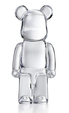 a clear bear figurine sitting on top of a table