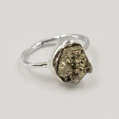 Natural Pyrite Raw Gemstone Ring, Solid 925 Ring, Pyrite Rough Stone Ring Jewelry, Golden Pyrite Raw Ring, Super Power Healing Gems Ring  Gemstone :  Pyrite Rough Gem Shape: Free Form Metal: 925 Sterling Silver Purity: 925 Parts Per 1000 Silver Polish: High Ring Size: All Size Available 🎁 Our products are totally handmade and made with high-quality gemstones and 925 sterling silver.  💎About Gemstone  Pyrite is the stone of protection and manifestation. It protects the wearer from negativities and evil thoughts. Also, it helps to achieve the goals set in life by its possessor.It is especially beneficial for those who have to travel rather regularly. We accept custom and personalized order. It can be change in the gemstone, ring design and ring size. Please send us message if you are inter Silver Rings With Raw Stone, Sterling Silver Rings With Raw Stone, Silver Raw Stone Anniversary Ring, Silver Rings With Raw Stone For Promise, Silver Raw Stone Ring For Anniversary, Sterling Silver Rings With Raw Details As A Gift, Silver Promise Ring With Raw Stone, Silver Anniversary Ring With Raw Stone, Raw Ring