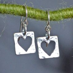 "Cut-out hearts in cute little hammered squares are a fun expression of living with an open heart.  Heart lovers young and old are delighted by these 3/8\" x 3/8\" sterling silver earrings.  They come boxed with a card that says Live with an Open Heart." Gift Earrings With Square Pendant For Pierced Ears, Gift Square Pendant Earrings For Pierced Ears, Square Pendant Earrings For Gift, Square Hypoallergenic Earrings For Gift, Hypoallergenic Square Earrings For Gifting, Hypoallergenic Square Earrings As Gift, Hypoallergenic Square Earrings For Gifts, Silversmithing Jewelry, Love Earrings