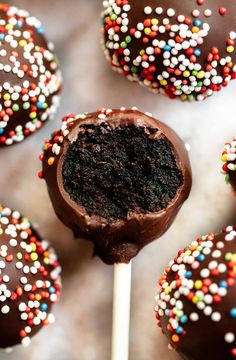 chocolate covered cake pops with sprinkles on top