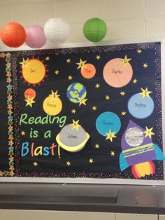 a classroom door decorated with planets and stars