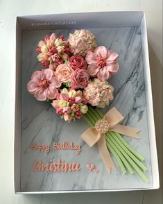 a birthday card with flowers in a box