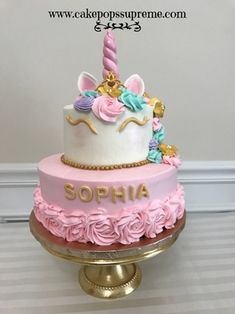 a pink and gold birthday cake with a unicorn horn on top that says sophia