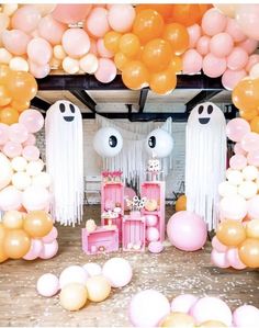 a room filled with balloons and decorations