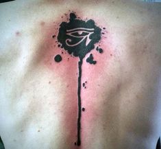 the back of a man's chest with black ink splattered on it