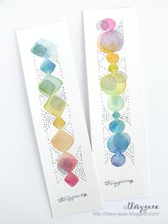 two bookmarks with watercolor designs on them