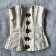 Only Worn Once Gorgeous Corset With Intricate Front Latches. Proper Lace Up. I Have Size 26 Inch Waste. This Is A 20 And I Squeezed Into It! Elegant Beige Wedding Corset, Elegant Beige Corset For Evening, Elegant Gold Wedding Corset, Beige Fitted Underbust Corset, Luxury Fitted Cream Corset, Beige Vintage Overbust Corset, Cream Corset Top, Vintage Cream Underbust Corset, Victorian Corset