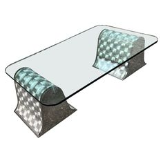 a glass and metal coffee table with checkered fabric