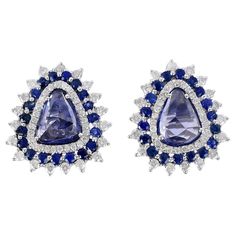 Handcrafted from 18-karat gold, this stud earrings is set with 3.3 carats of sapphire and .83 carats of glimmering diamonds. FOLLOW MEGHNA JEWELS storefront to view the latest collection & exclusive pieces. Meghna Jewels is proudly rated as a Top Seller on 1stDibs with 5 star customer reviews. All items manufactured by us are handmade and can be customized or redesigned. Composition Size-18X16 MM Total Weight-6.08 Gold Weight(Gms)-5.254 Diamond Wt(Cts)-0.83 Blue Sapphire Wt(Cts)-3.3 Gia Certified Sapphire Diamond Earrings For Formal Occasions, Formal Gia Certified Sapphire Diamond Earrings, Gia Certified Sapphire Earrings For Formal Occasions, Blue Sapphire Diamond Earrings Gia Certified, Formal Brilliant Cut Lab-created Sapphire Earrings, Luxury Lab-created Sapphire Earrings For Formal Occasions, Luxury Lab-created Sapphire Earrings For Formal Events, Gia Certified Sapphire Diamond Earrings, Sapphire Pear-shaped Earrings Fine Jewelry