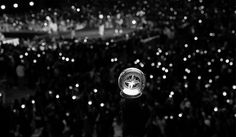 a snow globe sitting on top of a table in front of a crowd