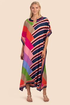 Our top-rated dress is back in a flattering, double print. Bright, rainbow color-blocking is complemented by bold stripes in the same color palette for a uniquely original look. In luxe silk, this sleek, maxi-dress caftan can be worn on its own, for a romantic dinner under the stars, or as a chic beach cover-up for you Cutout Neckline, Coverup Swimsuit, Beach Kaftan, St Croix, Bright Rainbow, Romantic Dinner, Beach Wear Dresses, Maxi Robes, Elegant Dresses Long