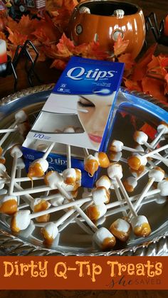 a plate full of marshmallows and candy sticks with the words dirty q - tip treats on it