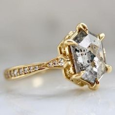 an engagement ring with a fancy diamond in the center