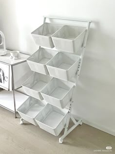 a white shelf with many baskets on it