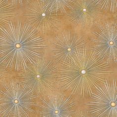 an artistic wallpaper with gold and silver stars on brown paper, as well as the sunbursts