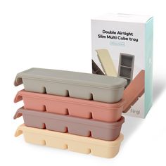 three storage containers stacked on top of each other in front of a box that says double airlight slim multi cube trays