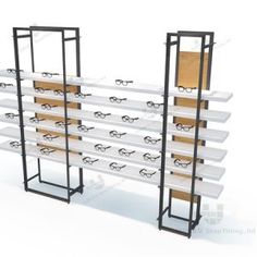 three metal shelving racks with eyeglasses on them and one shelf holding several pairs of glasses