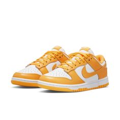 The Nike Dunk Low 'Laser Orange' comes in a basic two-tone colour pattern that keeps faithful to the original colour blocking of the iconic hoops sneaker. The upper is made of white leather with brilliant orange overlays and a distinctive Swoosh in the same colour. The low-cut collar is lined with soft textile for a comfortable fit. Nike logos appear on the sockliner, heel tab, and woven tongue tag. The sneaker is supported by an orange rubber outsole that is intended to grip the hardwood. Jordan 11 Retro Low, Womens Air Jordans, Jordan 11 Retro, Comfortable Sneakers, Jordan 1 Retro High, Hummel Sneaker, Dunk Low