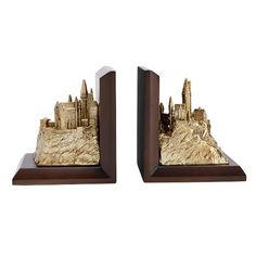 a pair of bookends that are made out of wood and have buildings on them