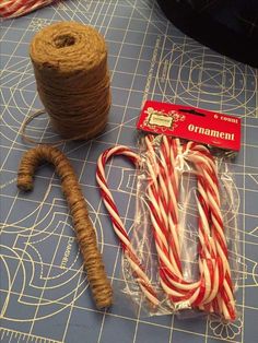 some candy canes and twine on a table