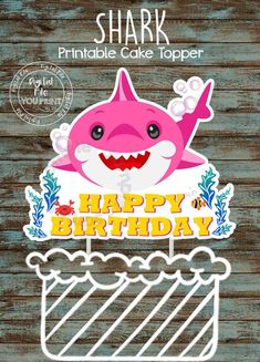 a shark cake topper with the words happy birthday written on it and an image of a