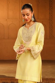 Lemon yellow kurta, adorned with kashmiri tilla, parsi gara embroidery and highlighted with basra moti. Paired with a dogri salwar. - Aza Fashions Elegant Semi-stitched Kurta With Cutdana Detail, Elegant Semi-stitched Kurta With Cutdana, Elegant Kurta With Cutdana For Festivals, Elegant Cutdana Kurta For Festivals, Elegant Kurta With Cutdana In Traditional Drape, Elegant Cutdana Kurta With Traditional Drape, Elegant Cutdana Embellished Kurta With Traditional Drape, Elegant Yellow Traditional Wear For Festive Occasions, Elegant Slub Silk Kurta With Zari Work