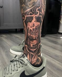 a man's leg with a tattoo on it and a nike air force 1