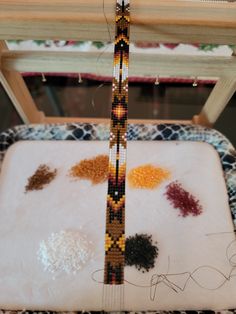 a close up of a box with beads on it