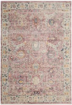 a pink rug with an ornate design on the top and bottom, in various colors