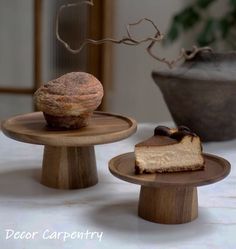 two small wooden plates with pastries on them