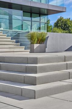 concrete steps leading up to a modern building