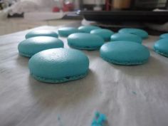 blue cookies are lined up on a table