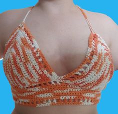 Crochet Lilly crop top. super cute and breathable. Perfect for the summer weather. 100% Cotton Crochet Crop Top For Beach, Crochet Crop Top For The Beach, Hippie Halter Neck Crochet Top For Summer, Summer Crochet Lace Halter Top, Handmade Summer Crochet Halter Neck Top, Bohemian Crochet Halter Neck Crop Top, Hippie Cotton Crochet Top For Beach, Bohemian Crochet Crop Top With Halter Neck, Handmade Halter Neck Crochet Top For Summer