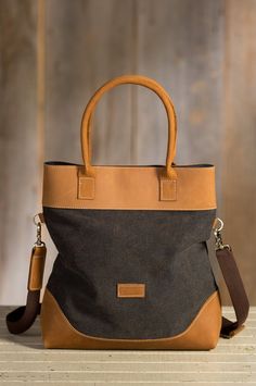 Overland Bremer Convertible Canvas and Leather Handbag | Overland Canvas Bags With Double Handle, Large Capacity Top Handle Canvas Bag For On-the-go, Large Capacity Canvas Satchel For Shopping, On-the-go Satchel With Leather Handles, Large Canvas Satchel For Shopping, Black Canvas Satchel With Handles, Black Canvas Satchel, Canvas Travel Bag With Top Carry Handle, Brown Canvas Weekender Bag With Top Carry Handle