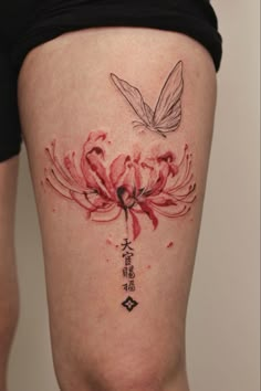 a woman's thigh with flowers and a butterfly on it