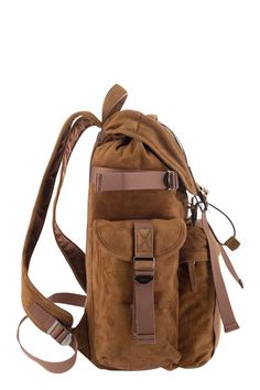 This stunning medium suede backpack is the epitome of luxury and functionality. Crafted with the finest suede leather, it features an adjustable shoulder strap and a convenient hand handle for easy carrying. The custom metal buckles and flap closure add a touch of elegance, while the flat top pocket and large front zipped pocket provide ample storage space for all your essentials. The practical flap pockets on the sides and fabric lining make this backpack a refined blend of craftsmanship and pr Suede Backpack, Tods Bag, Medium Backpack, Timeless Wardrobe Staples, Leather Cap, Custom Metal, Metal Buckles, Handbag Backpack, Browning