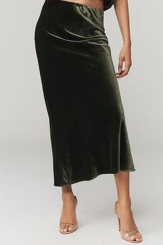 A slip skirt in the truest sense, the on-trend Tilda keeps it simply chic with a French-inspired bias-cut design that makes it drape and move just so . | The Tilda Maxi Slip Skirt: Velvet Edition by Anthropologie in Green, Women's, Size: Medium, Nylon/Viscose Green Velvet Skirt Outfits, Maxi Slip Skirt, Skirt Draping, Purple Maxi, Slip Skirts, Anthropologie Skirt, Simply Chic, Velvet Skirt, Slip Skirt